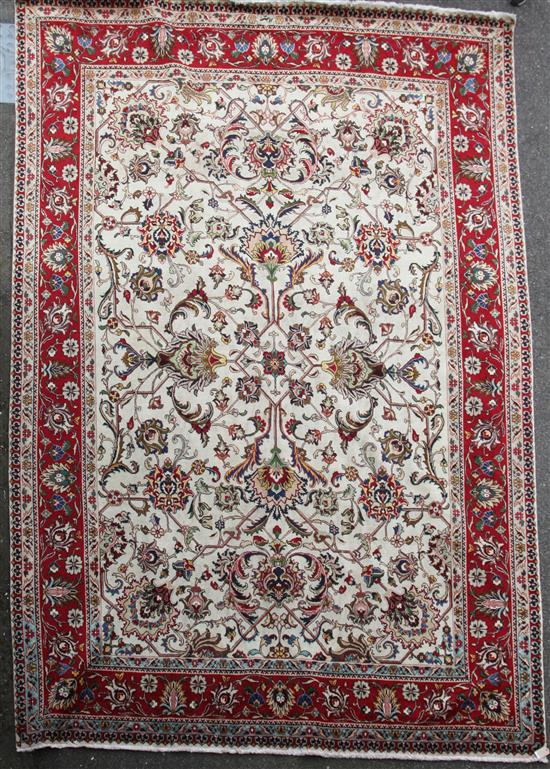 A large Persian Ivory ground carpet, 13ft 3in by 9ft 5in.